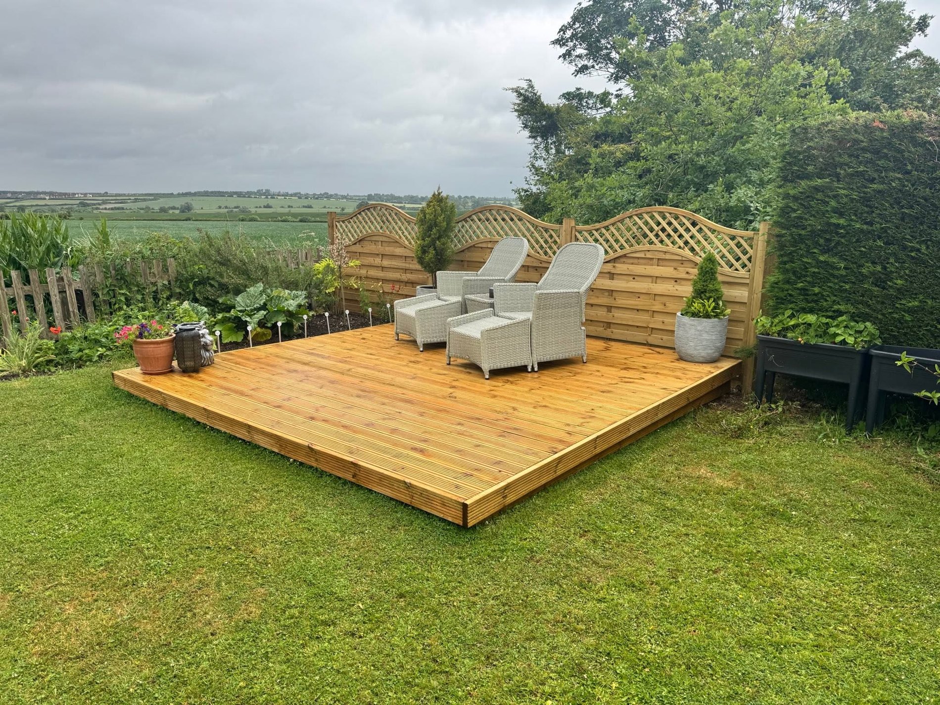 Timber deck and outdoor seating by TiC Fencing & Decking